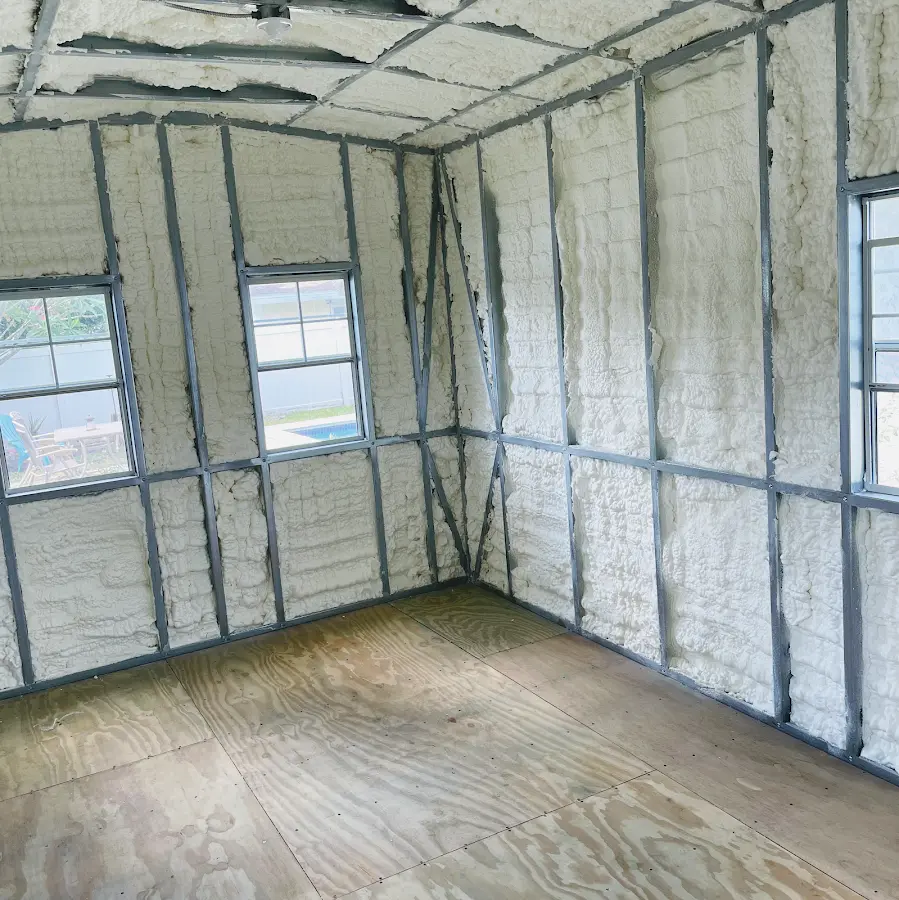 Closed-cell spray foam insulation applied to wall cavities in a residential project in Bolton
